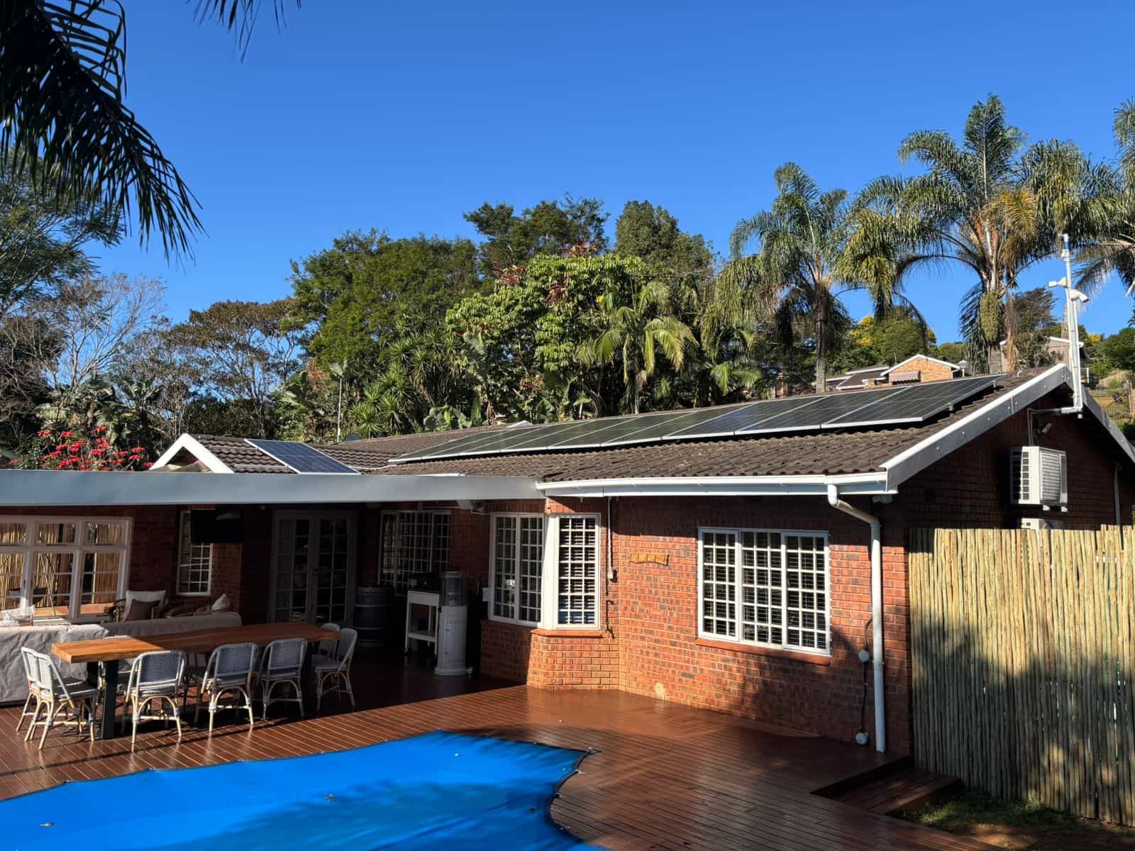 Solar energy installation in Durban - with clear blue skies and solar panels on the roof of the home